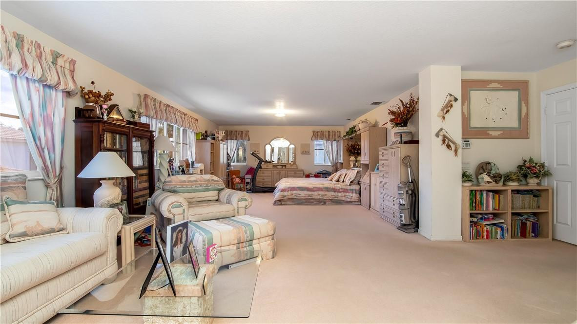 934 Crestview Circle Fort Lauderdale, FL 33327 - Photo 32 of 51 a living room with furniture and a book shelf