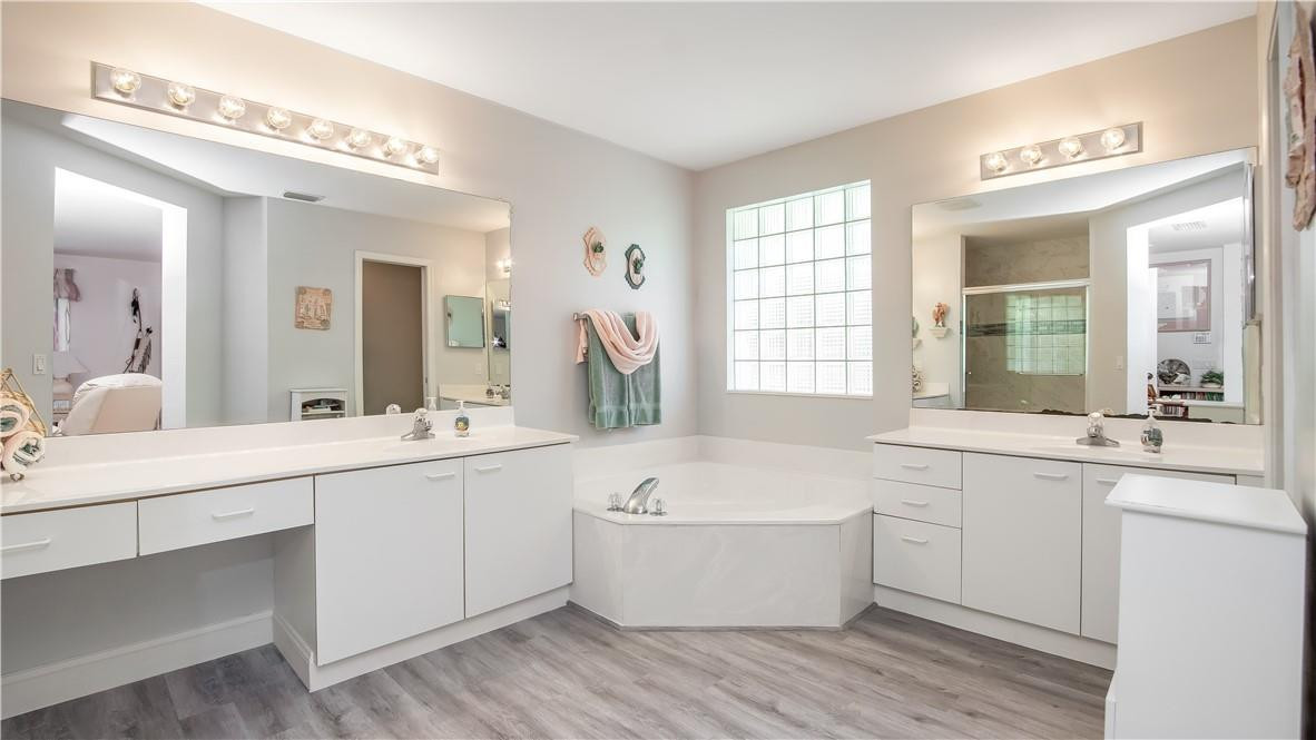 934 Crestview Circle Fort Lauderdale, FL 33327 - Photo 35 of 51 a large white bathroom with a large tub and sink