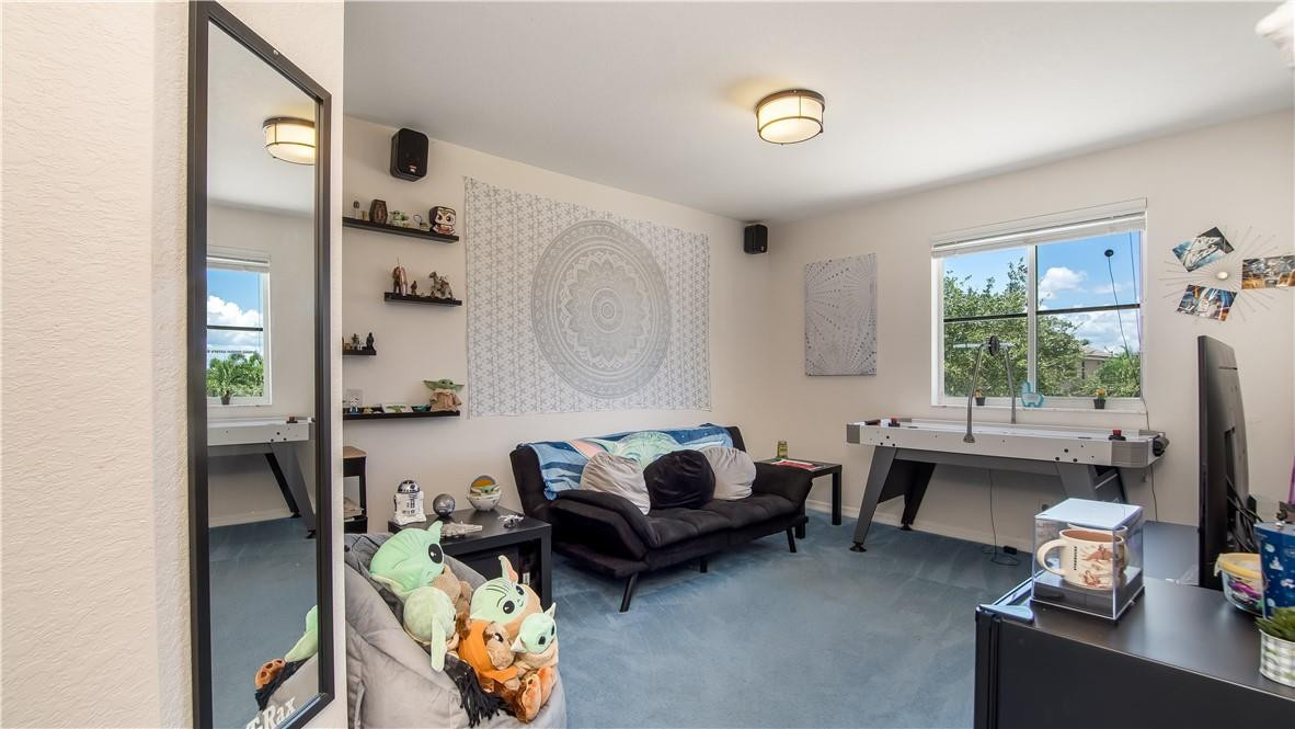 934 Crestview Circle Fort Lauderdale, FL 33327 - Photo 41 of 51 a living room with furniture a table and a window