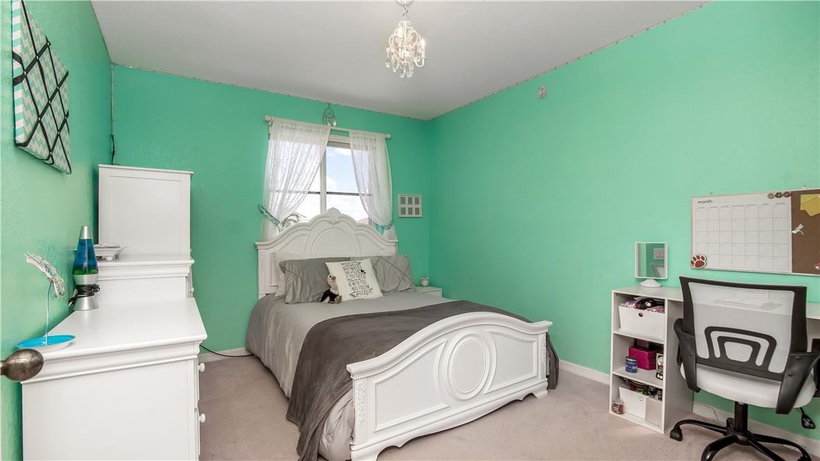 934 Crestview Circle Fort Lauderdale, FL 33327 - Photo 43 of 51 a bedroom with a bed and a window