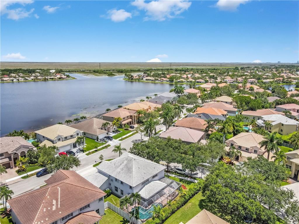 934 Crestview Circle Fort Lauderdale, FL 33327 - Photo 7 of 51 an aerial view of a house with a lake view
