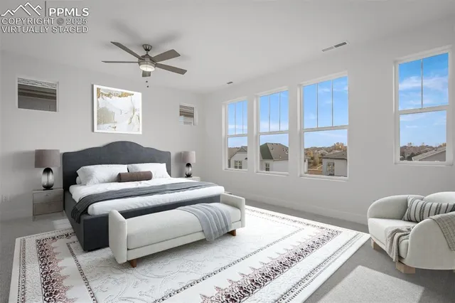 a bedroom with a bed and couch