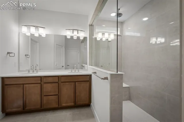 a bathroom with a double vanity sink and a mirror
