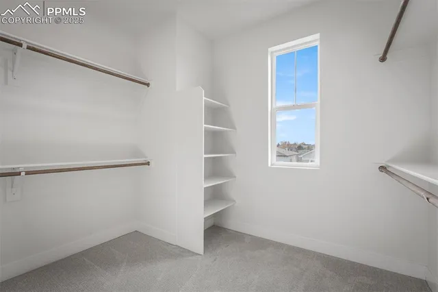 a view of an empty walk in closet