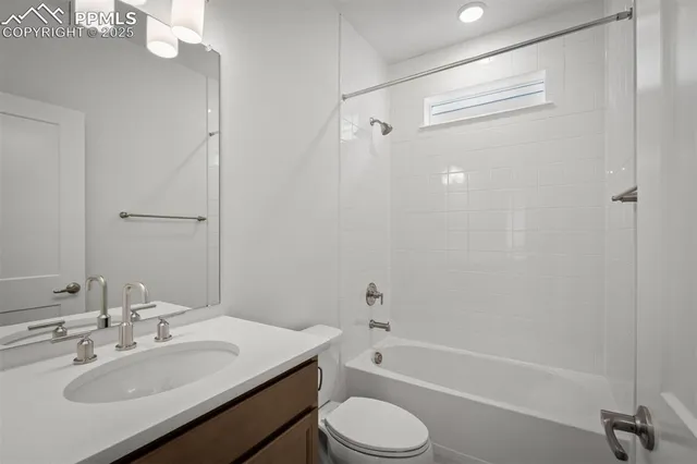a bathroom with a sink toilet tub and shower
