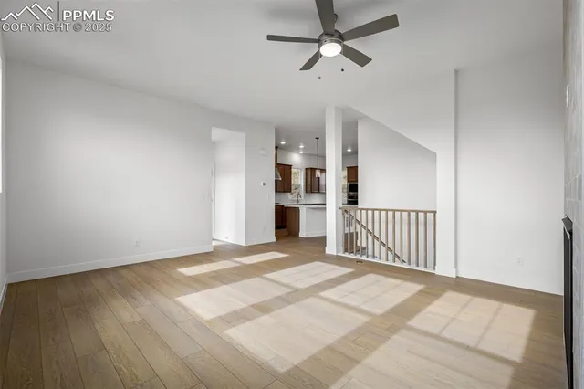 a view of a livingroom with a furniture wooden floor and window