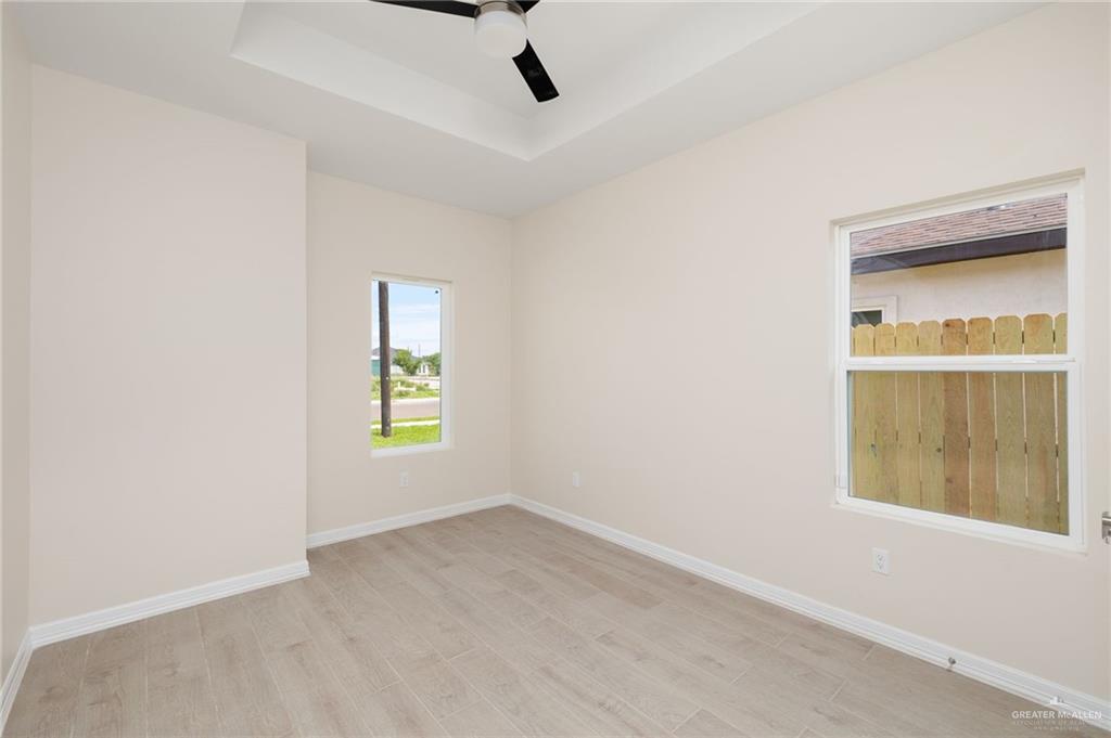 1717 Alisson Street Alton, TX 78573 - Photo 10 of 15 an empty room with a window