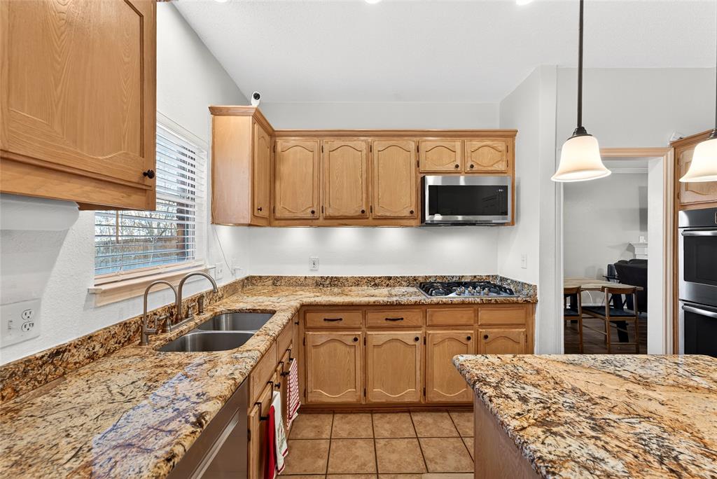 1804 Hunters Ridge Drive Grapevine, TX 76051 - Photo 11 of 36 Kitchen sink window with view of back yard