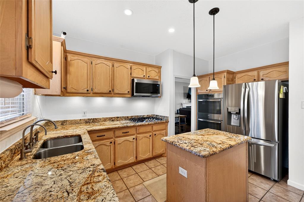 1804 Hunters Ridge Drive Grapevine, TX 76051 - Photo 9 of 36 Ample cabinets and counter tops in kitchen