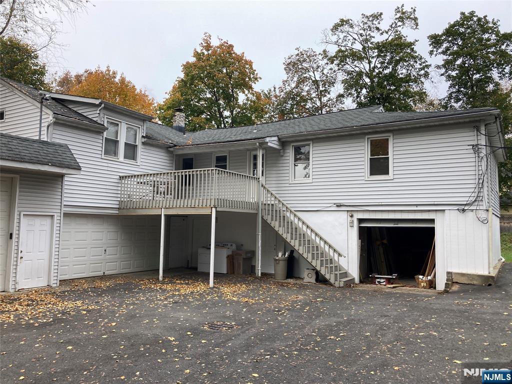 118 Doremus Avenue, Unit C Ridgewood, NJ 07450 - Photo 2 of 16 a view of a house with a yard and garage