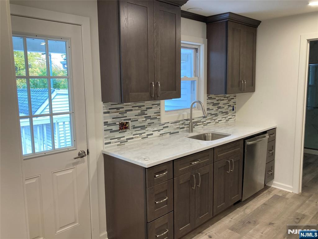118 Doremus Avenue, Unit C Ridgewood, NJ 07450 - Photo 5 of 16 a bathroom with a sink and a mirror