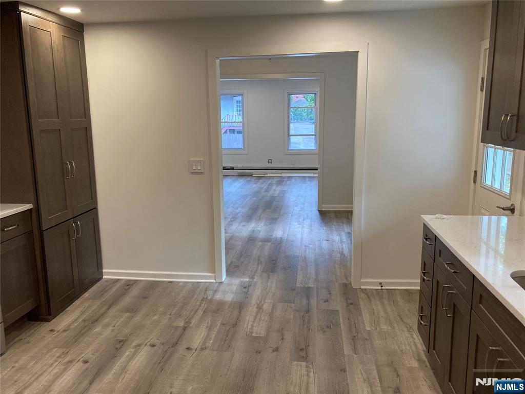 118 Doremus Avenue, Unit C Ridgewood, NJ 07450 - Photo 8 of 16 a view of hallway with wooden floor
