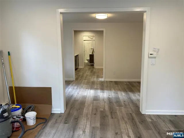 a view of a room with wooden floor and chair