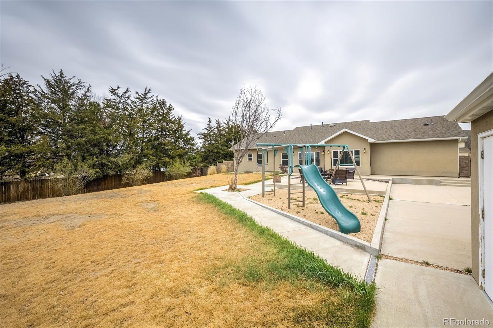 675 9th Street Limon, CO 80828 - Photo 11 of 49 a view of house with swimming pool and sitting area