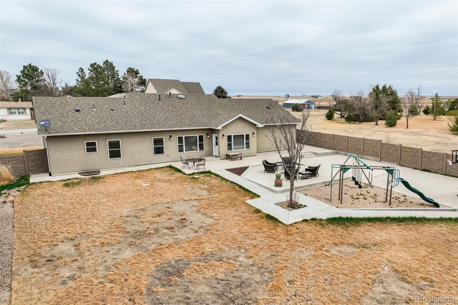 675 9th Street Limon, CO 80828 - Photo 12 of 49 a house with trees in the background