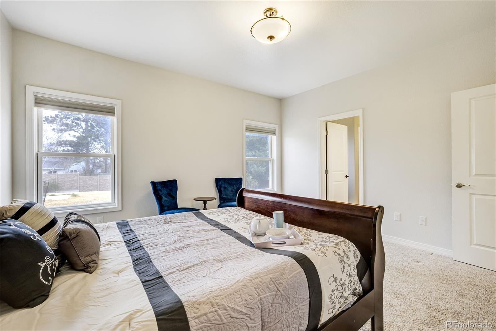 675 9th Street Limon, CO 80828 - Photo 28 of 49 a bedroom with a bed and a couch