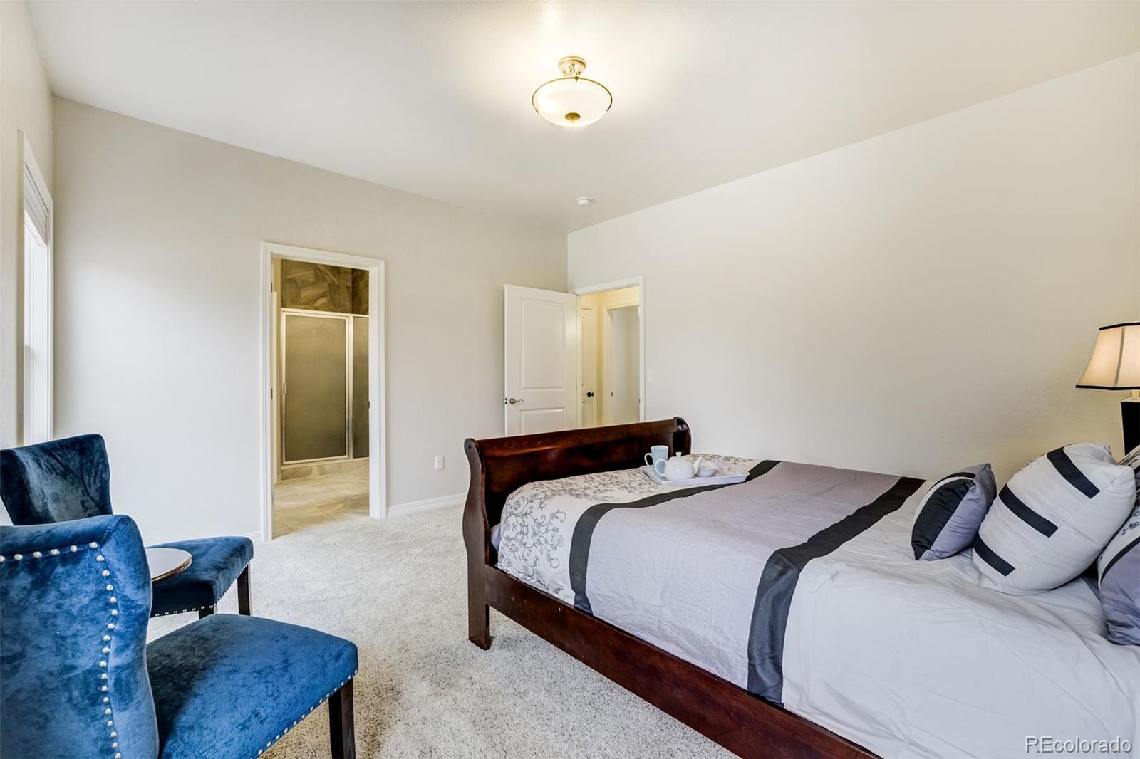 675 9th Street Limon, CO 80828 - Photo 29 of 49 a bedroom with a bed and wooden floor