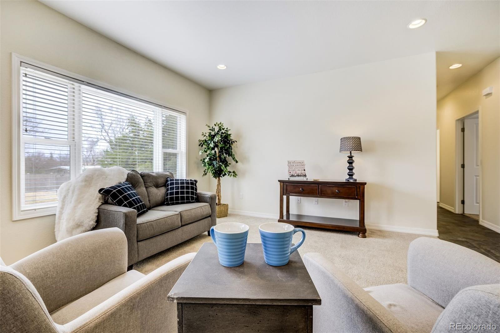 675 9th Street Limon, CO 80828 - Photo 3 of 49 a living room with furniture and a large window