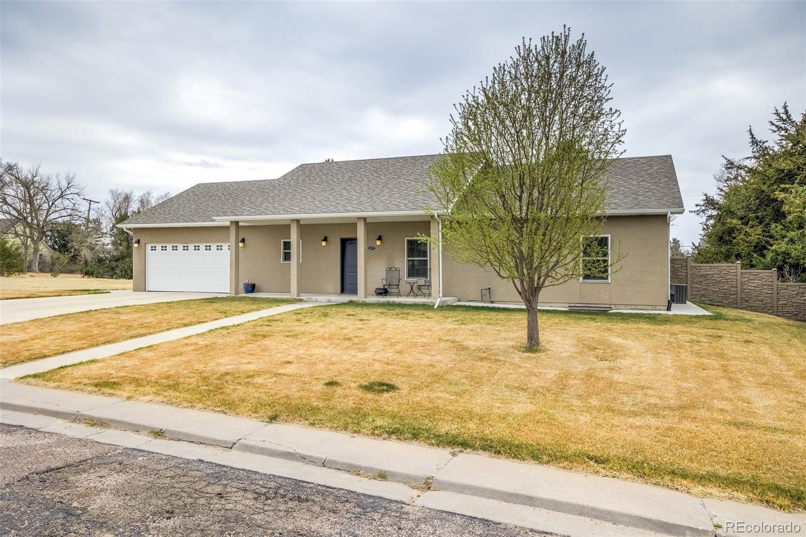 675 9th Street Limon, CO 80828 - Photo 44 of 49 a front view of a house with a yard and garage