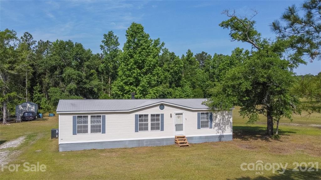 340 Old Bridge Road Rocky Point, NC 28457 - Photo 2 of 35 a front view of a house with a yard