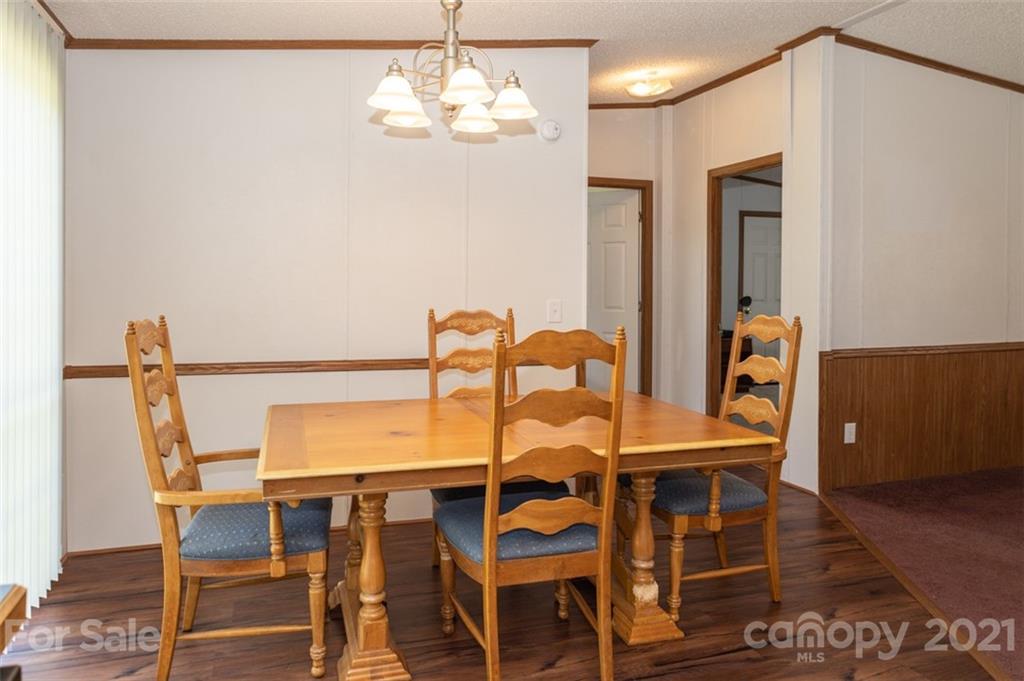 340 Old Bridge Road Rocky Point, NC 28457 - Photo 13 of 35 a view of a dining room with furniture and chandelier
