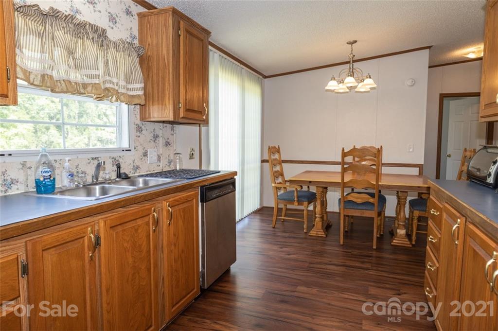 340 Old Bridge Road Rocky Point, NC 28457 - Photo 15 of 35 a view of a dining room with furniture window and wooden floor