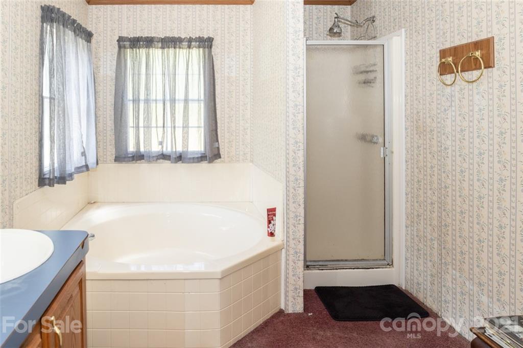 340 Old Bridge Road Rocky Point, NC 28457 - Photo 21 of 35 a bathroom with a bathtub and a shower