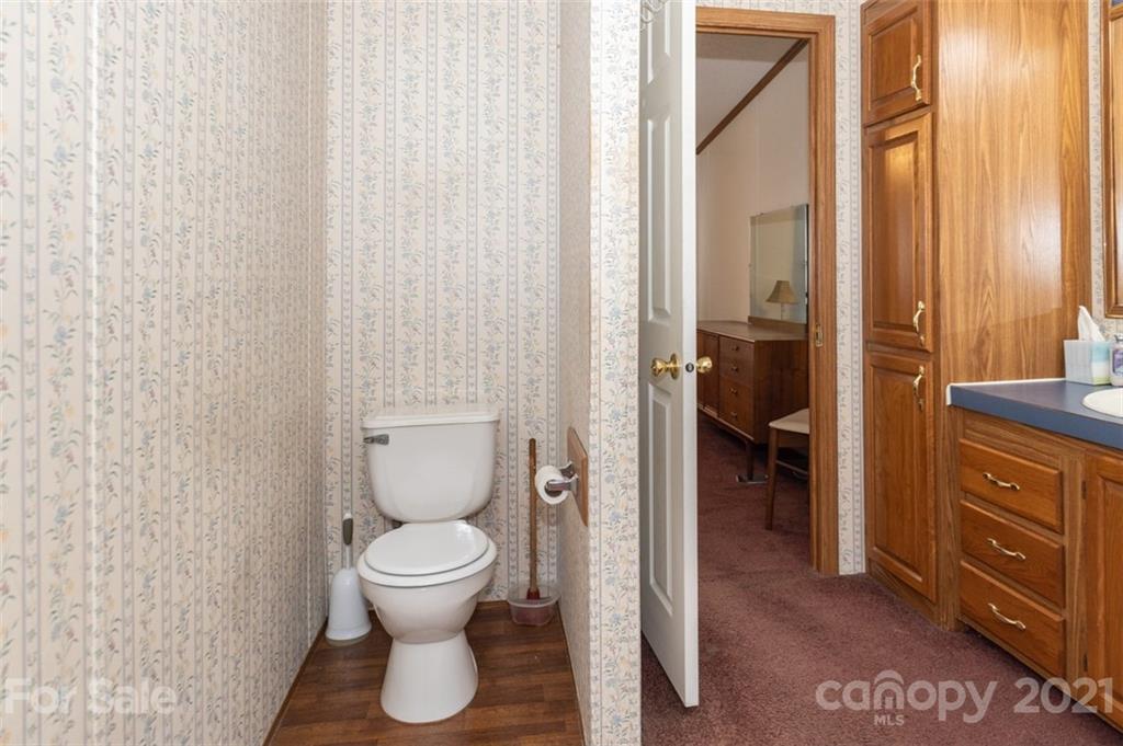 340 Old Bridge Road Rocky Point, NC 28457 - Photo 23 of 35 a bathroom with a toilet and a sink