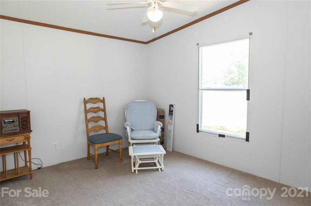 340 Old Bridge Road Rocky Point, NC 28457 - Photo 24 of 35 a room with a chair and a window