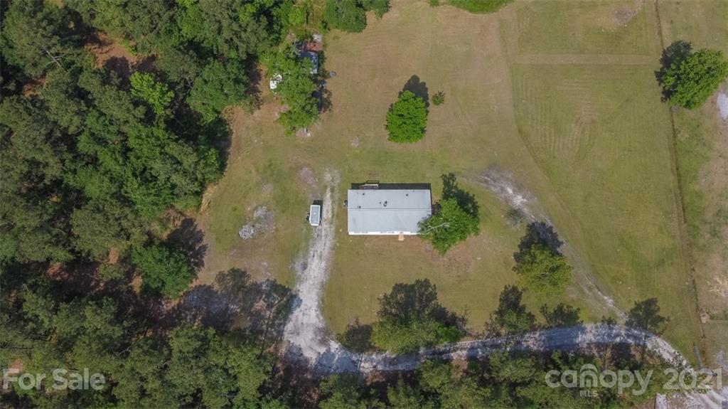 340 Old Bridge Road Rocky Point, NC 28457 - Photo 4 of 35 an aerial view of a house with a yard