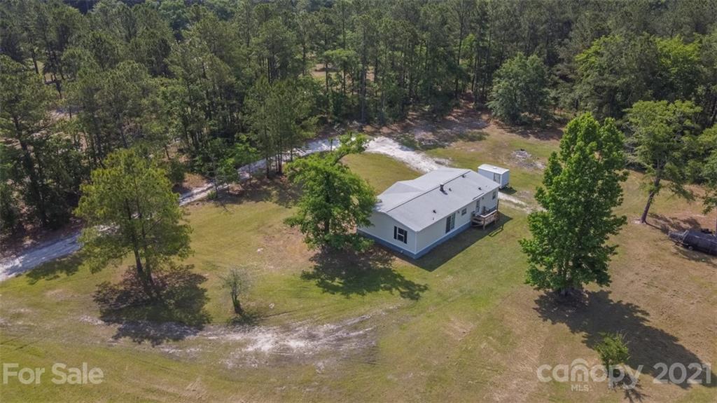 340 Old Bridge Road Rocky Point, NC 28457 - Photo 32 of 35 an aerial view of a house with a yard