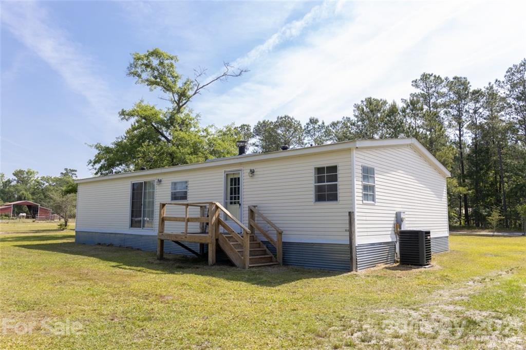 340 Old Bridge Road Rocky Point, NC 28457 - Photo 34 of 35 a view of a house with a backyard