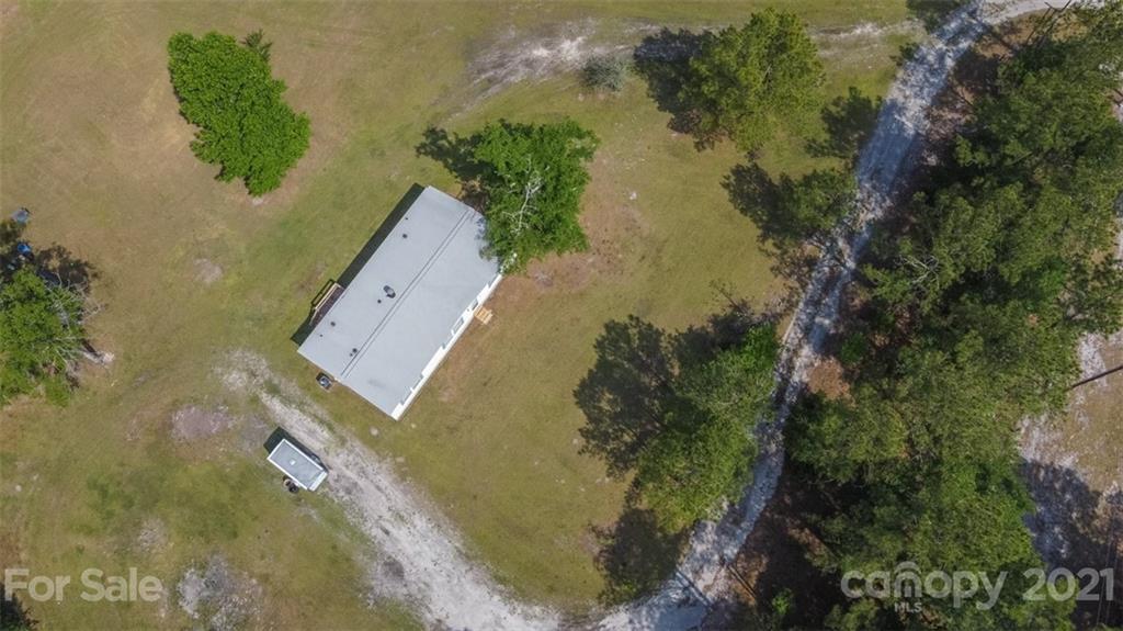 340 Old Bridge Road Rocky Point, NC 28457 - Photo 5 of 35 an aerial view of a house with a yard
