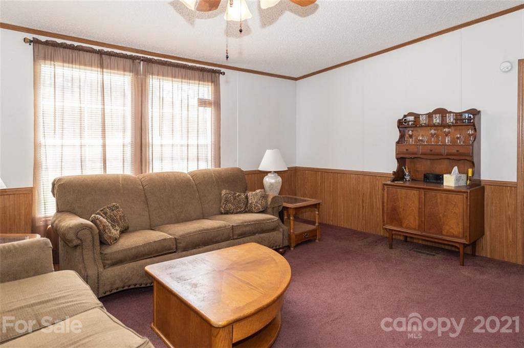 340 Old Bridge Road Rocky Point, NC 28457 - Photo 7 of 35 a living room with furniture and a window