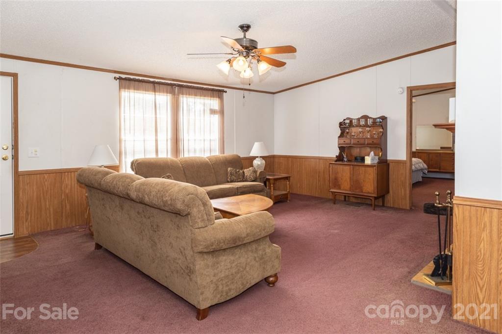 340 Old Bridge Road Rocky Point, NC 28457 - Photo 10 of 35 a living room with furniture and a large window
