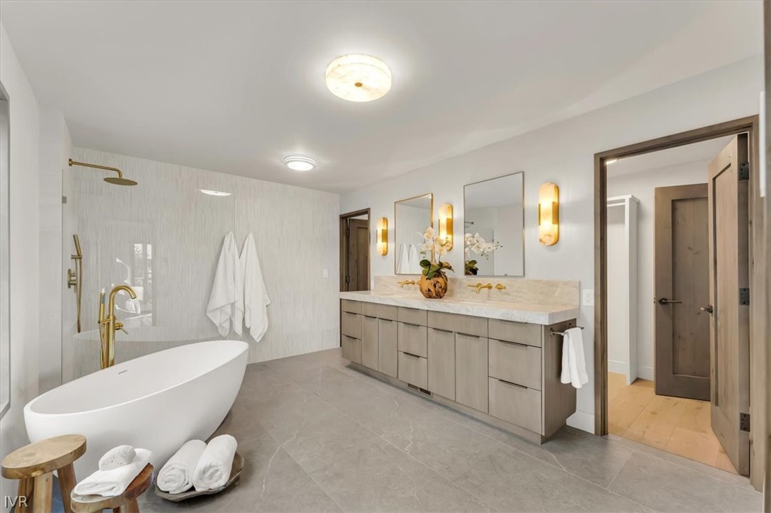877 Tyner Way Incline Village, NV 89451 - Photo 23 of 43 a bathroom with a granite countertop sink mirror and bathtub