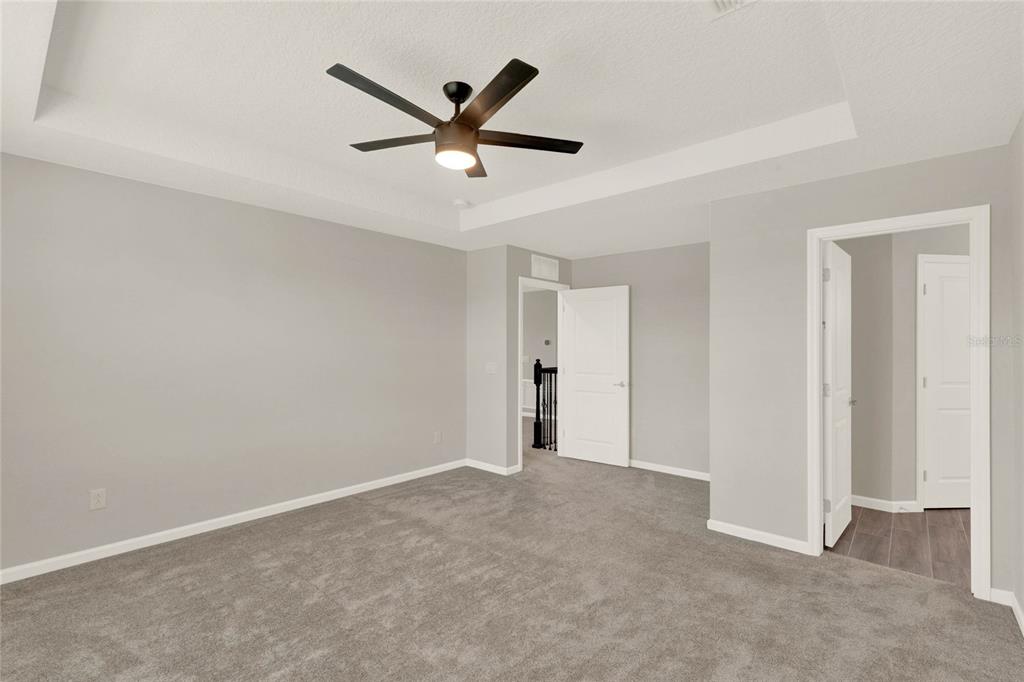 2575 Park Ridge Street Apopka, FL 32712 - Photo 31 of 56 Primary bedroom with updated ceiling fan & light fixture