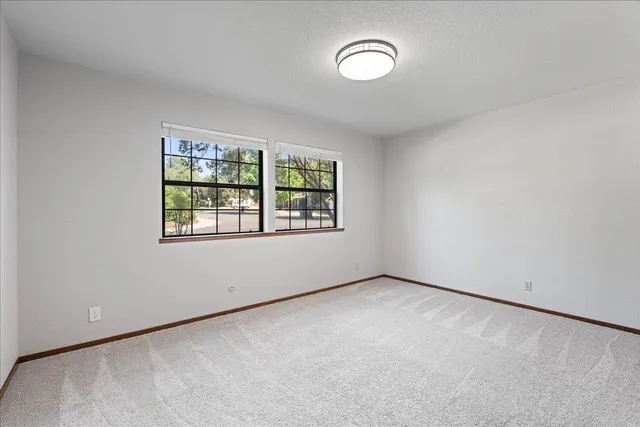 an empty room with windows