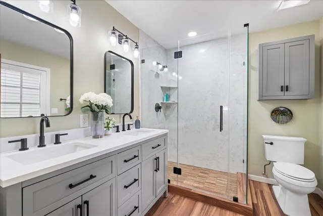 a bathroom with a toilet and a shower