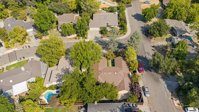 an aerial view of town with residential houses and trees