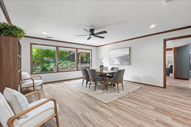 a dining room with furniture window wooden floor