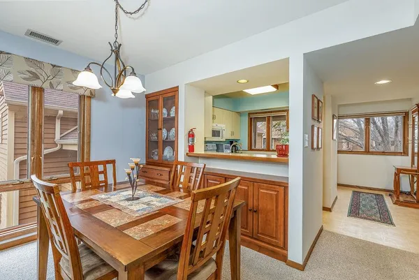 a dining room with furniture and window