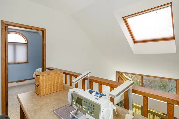 a living room with a couch and a stove top oven