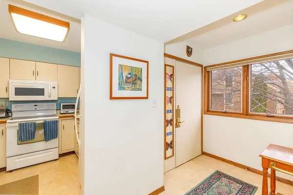a kitchen with stainless steel appliances a refrigerator and a stove top oven