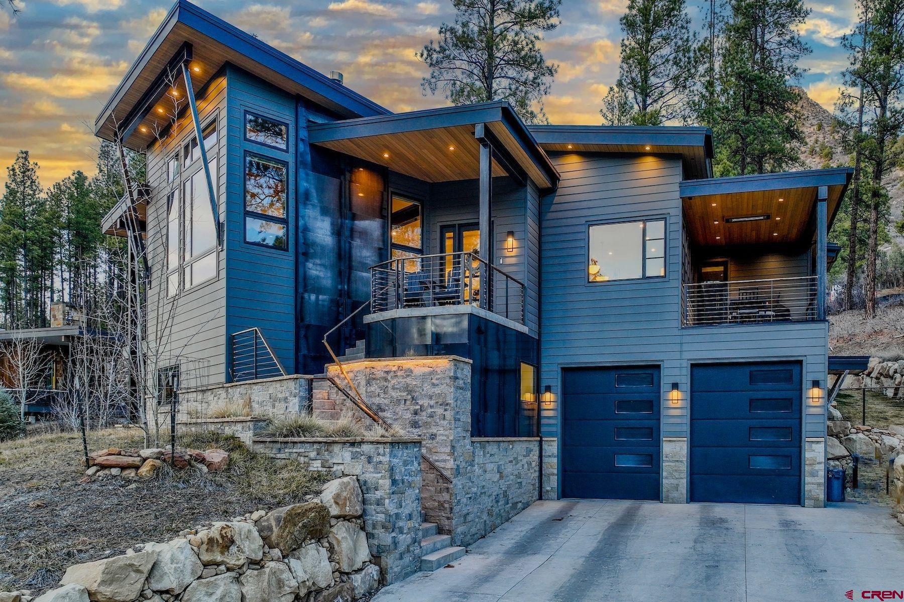 46 Bell Flower Court Durango, CO 81301 - Photo 1 of 40 a front view of a house with a yard