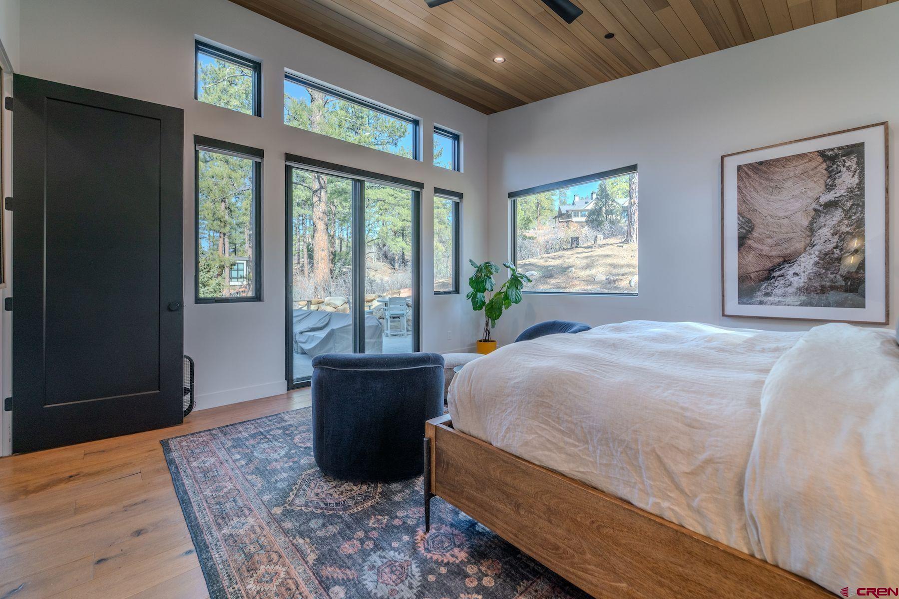 46 Bell Flower Court Durango, CO 81301 - Photo 19 of 40 a spacious bedroom with a large bed and a window