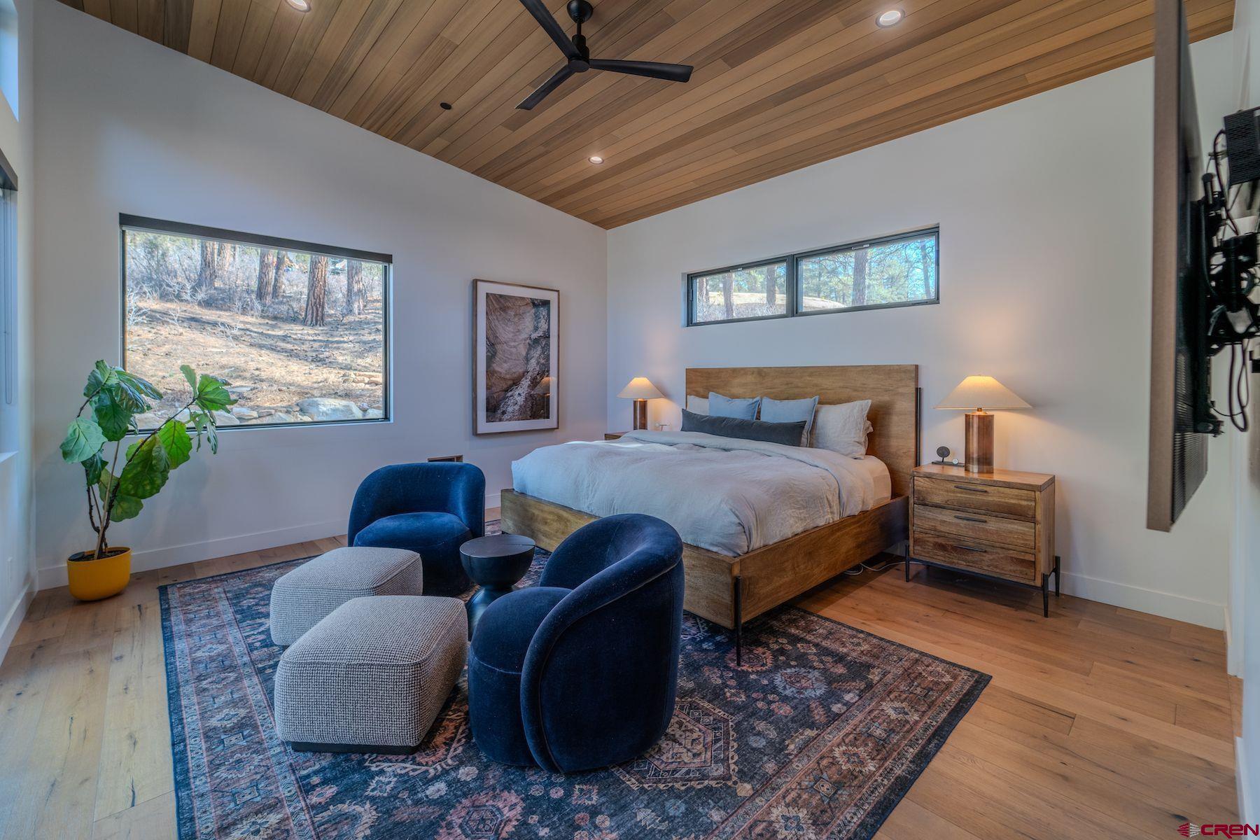 46 Bell Flower Court Durango, CO 81301 - Photo 20 of 40 a bedroom with furniture or couch and a potted plant