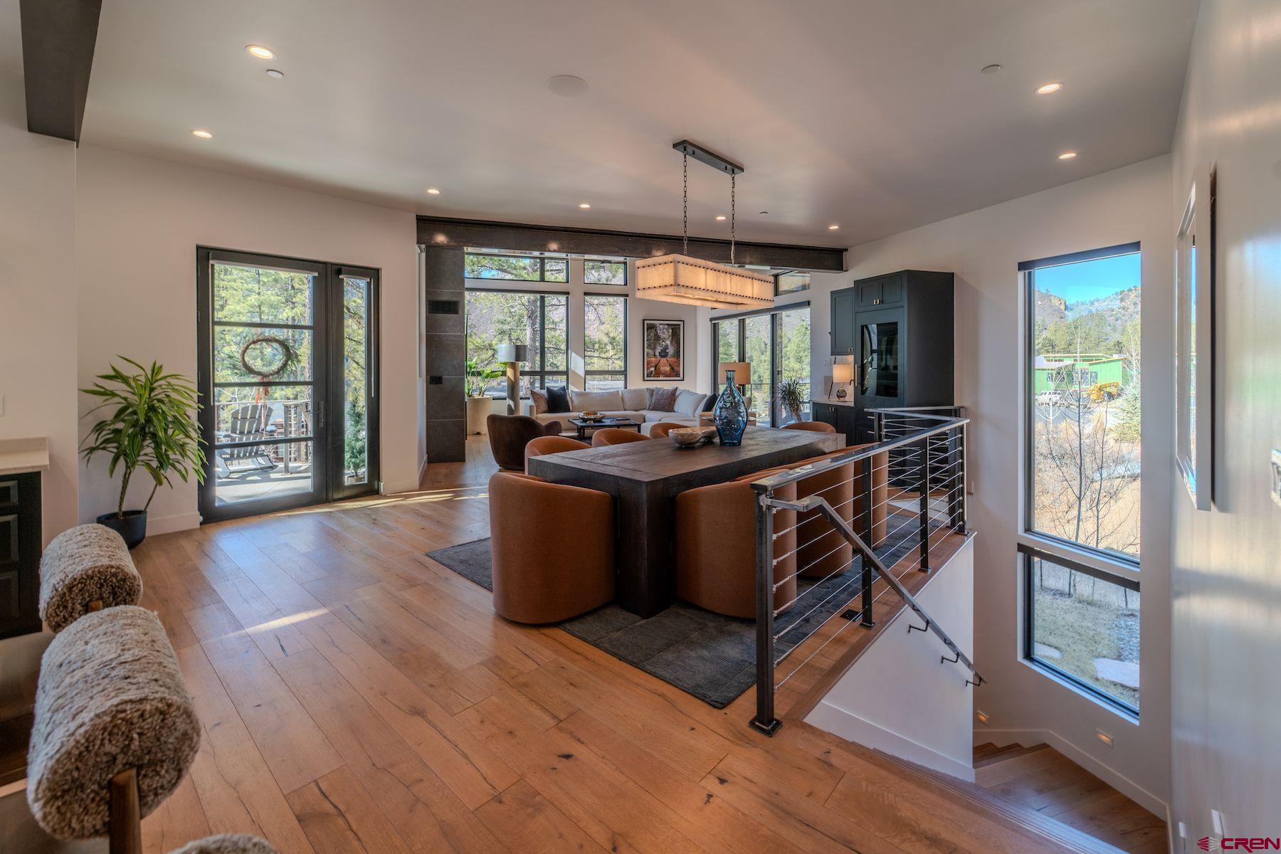 46 Bell Flower Court Durango, CO 81301 - Photo 3 of 40 a view of a dining room with furniture window and wooden floor