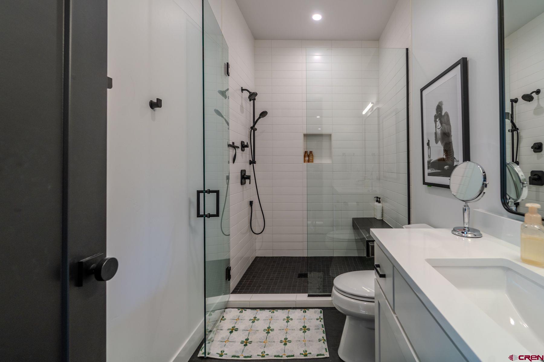 46 Bell Flower Court Durango, CO 81301 - Photo 33 of 40 a bathroom with a sink toilet and shower