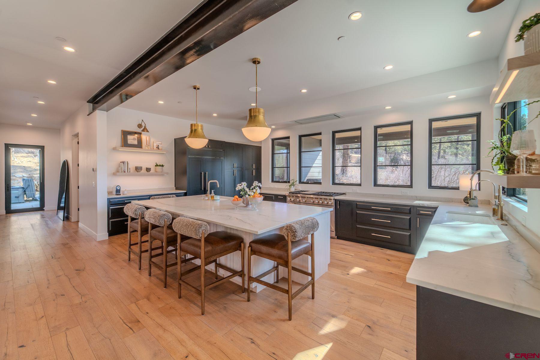 46 Bell Flower Court Durango, CO 81301 - Photo 4 of 40 a large kitchen with a table and chairs